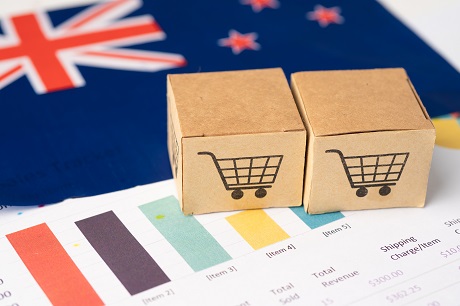 Box with shopping cart logo and New Zealand flag, Import Export Shopping online or eCommerce finance delivery service store product shipping, trade, supplier concept.