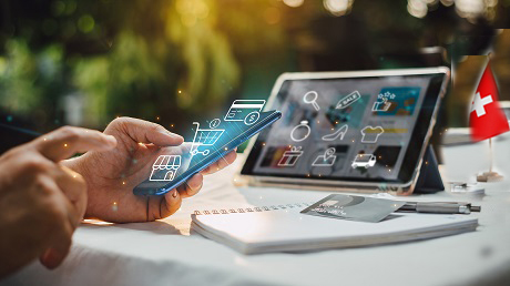 Businessman with mobile smartphone in hand paying online and shopping on virtual interface global network, online banking and digital marketing of e-commerce.
