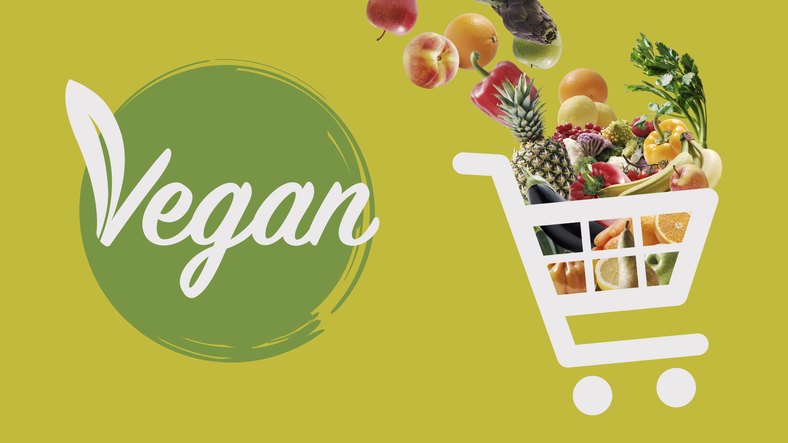 Vegan food online grocery shopping: shopping cart icon full of vegetables and fruits